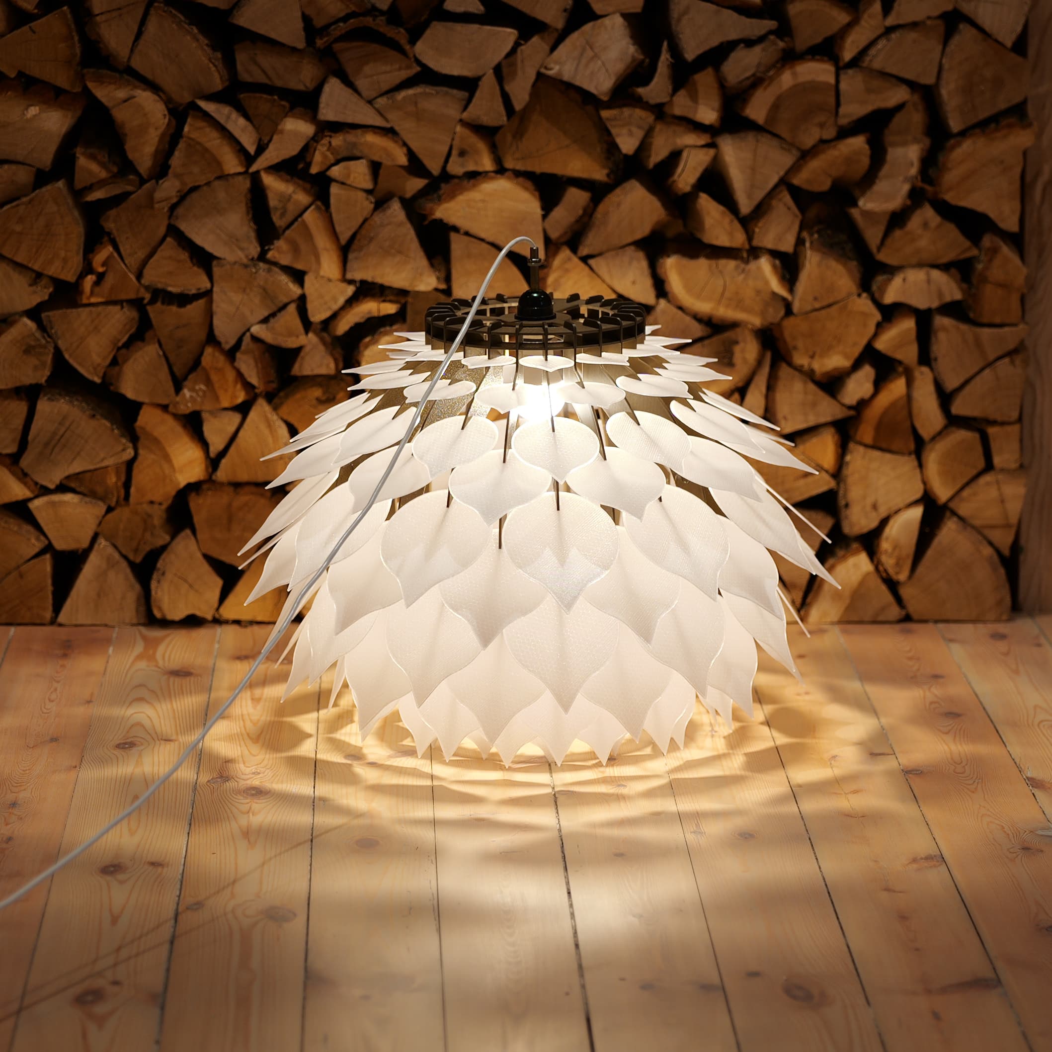 Cone Lamp lit up against a firewood wall