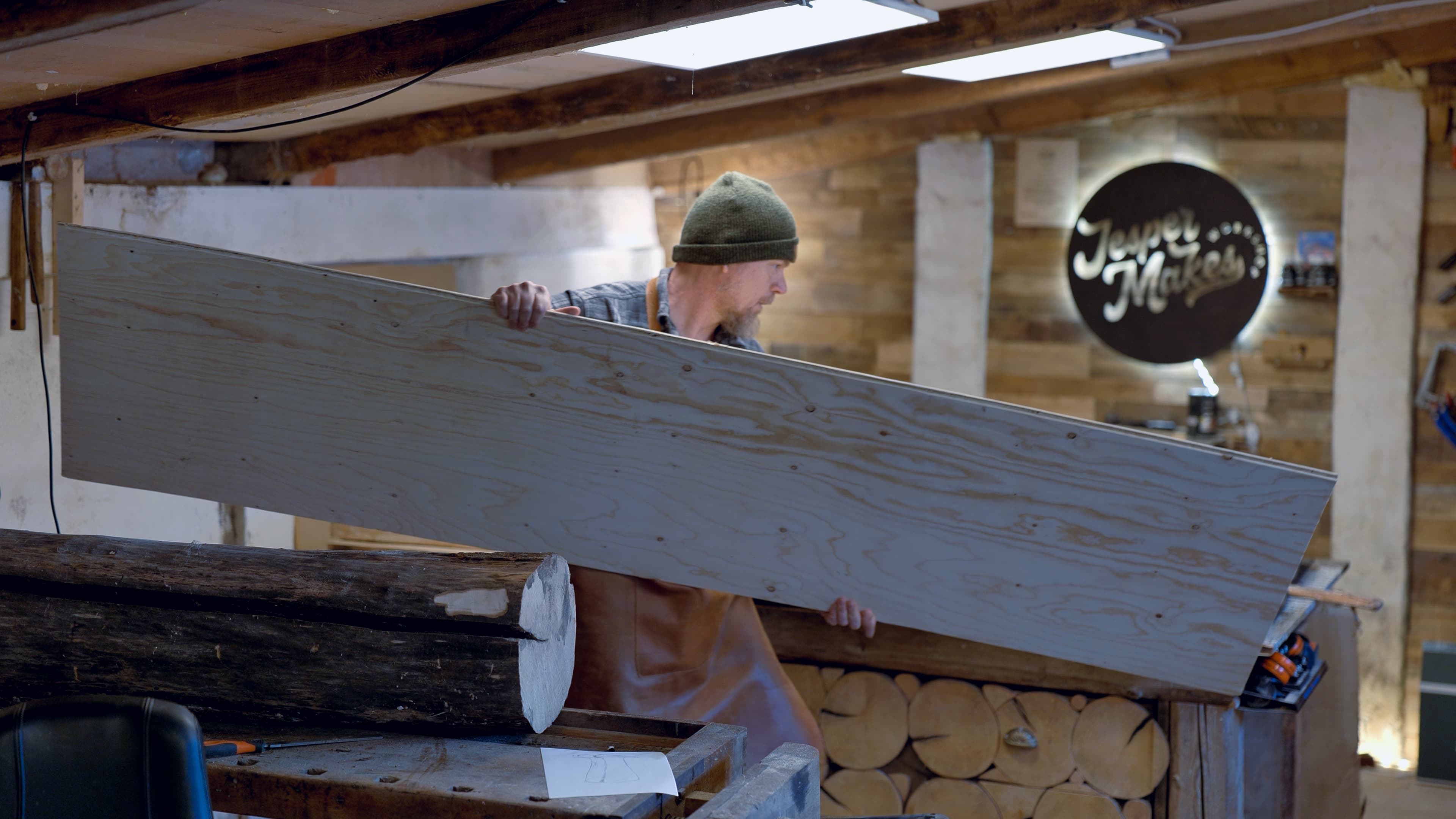 Jesper measuring a sheet of WISA birch plywood in the workshop
